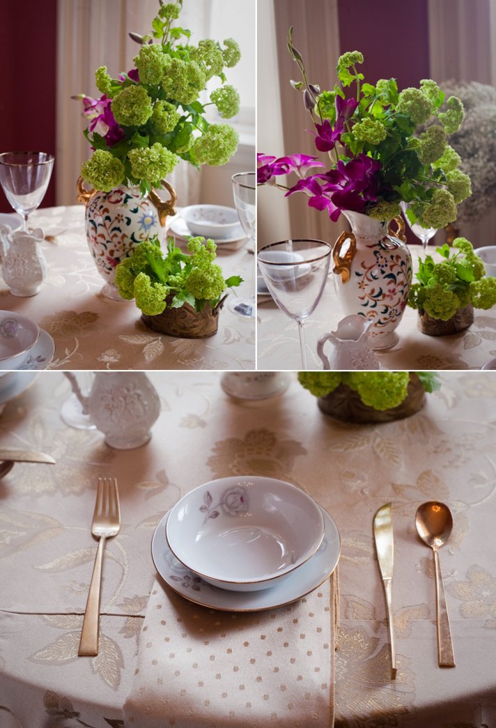 Green viburnums and purple orchids arranged in vintage wedding vases