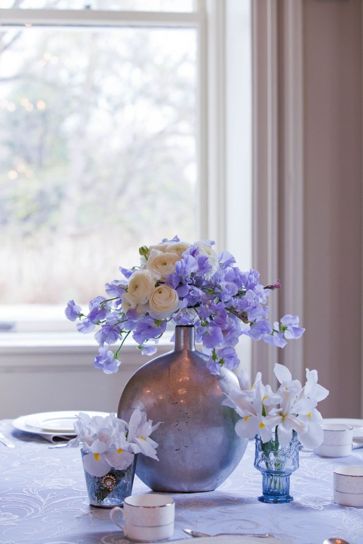 Whimsical ivory, blue and lilac wedding flower centerpieces