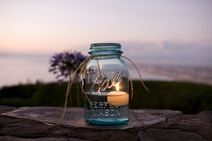 Wedding reception decor using mason jars- with romantic candles
