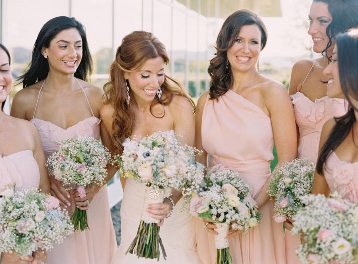 romantic bridal hairstyle half up bride with bridesmaids
