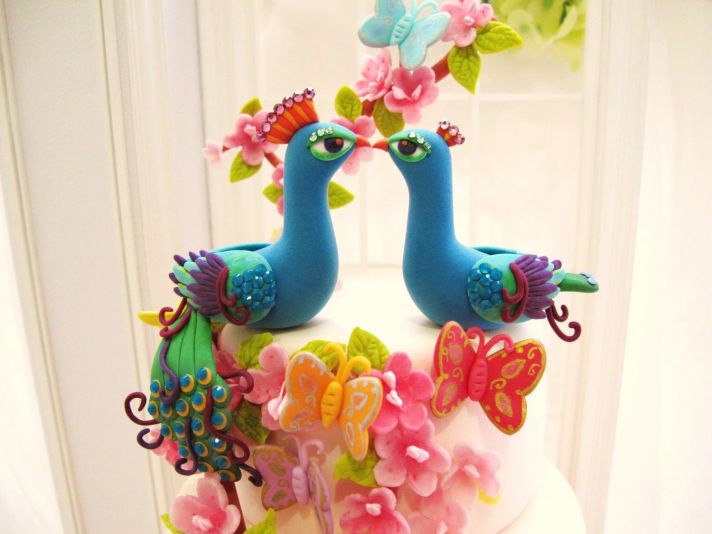 bright peacock wedding cake toppers