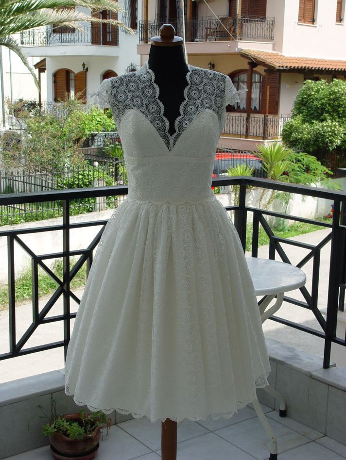 lovely lace LWDs for the brides wedding reception look cap sleeves with bows