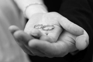holding wedding rings s