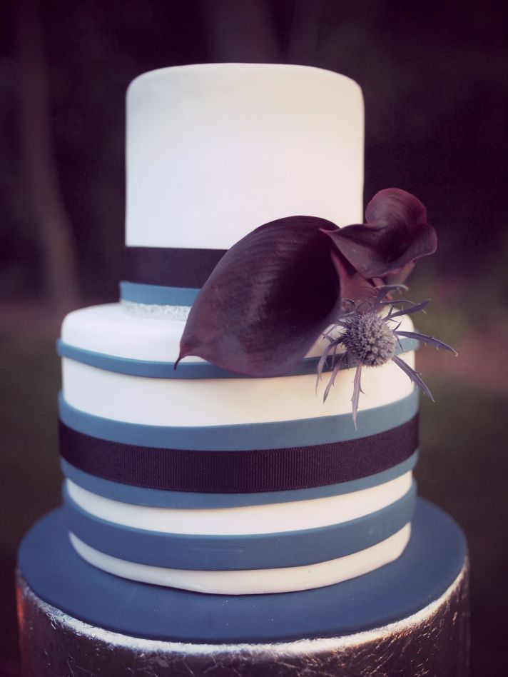 Two tiered purple and blue stripped wedding cake
