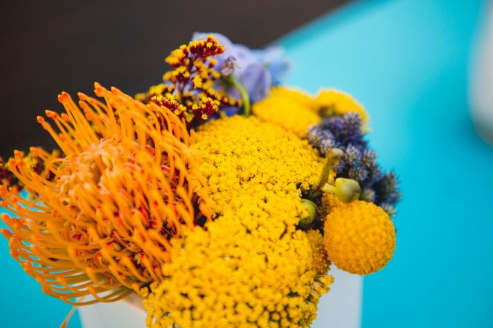 Pincushion Proteas and Billy Balls in Yellow and Purple Flower Arrangement