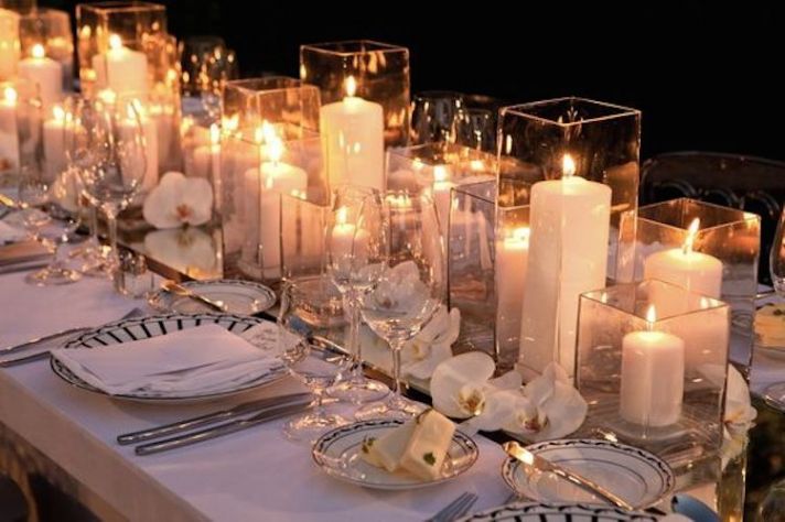 Romantic Centerpieces with Candle Filled Hurricane Vases