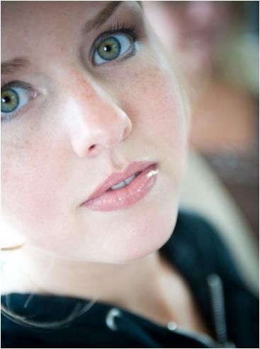 Closeup of beautiful bride with wedding day makeup, green eyes pop, natural lip