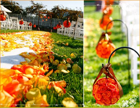 Orange and yellow petals line white aisle