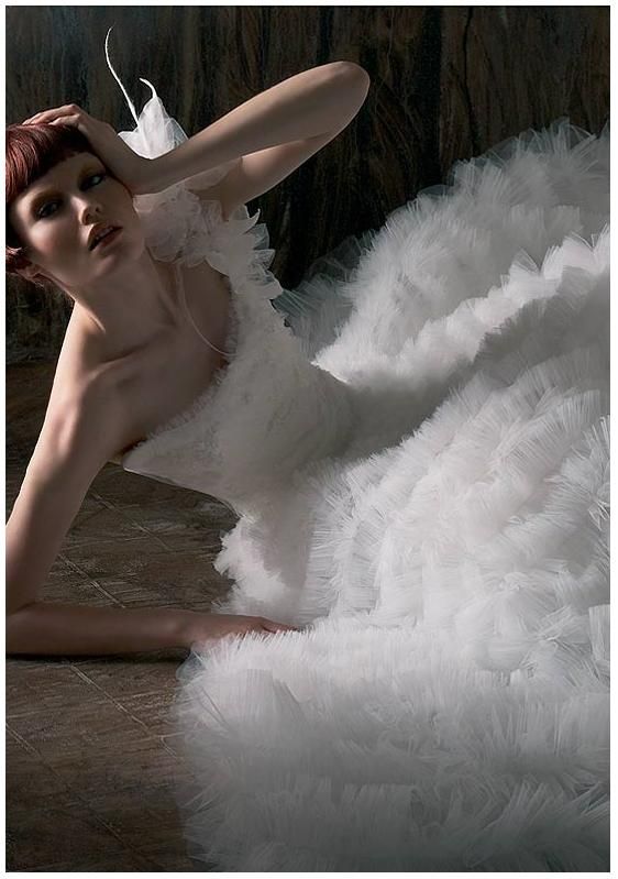 Exotic asymmetrical ruffled and tiered white wedding dress