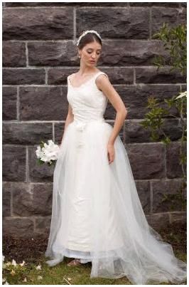 Conservative white wedding dress with hook-on and off tulle overskirt