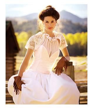 Vintage bride with modest lace wedding dress and modern short brown suede gloves with fringe