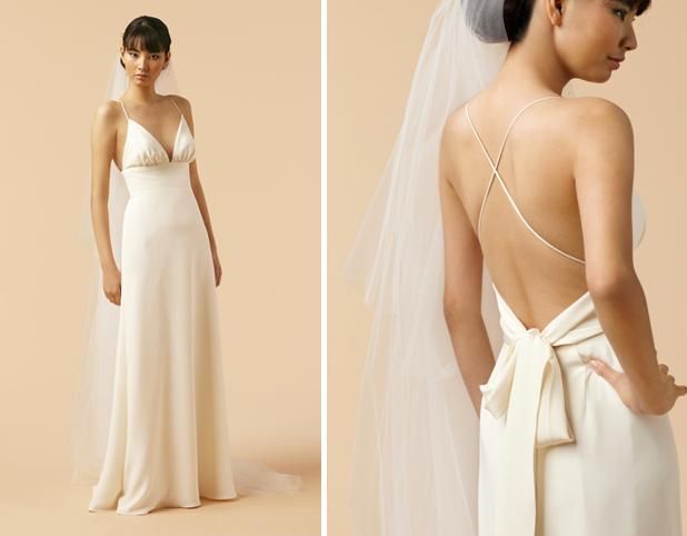 Sheath style v-neck ivory wedding dress with open back, perfect for a beach wedding