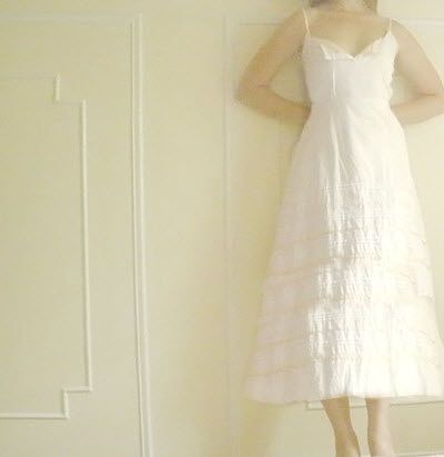 Casually beautiful, this white tea length wedding dress is perfect for a low-key beach or picnic wed