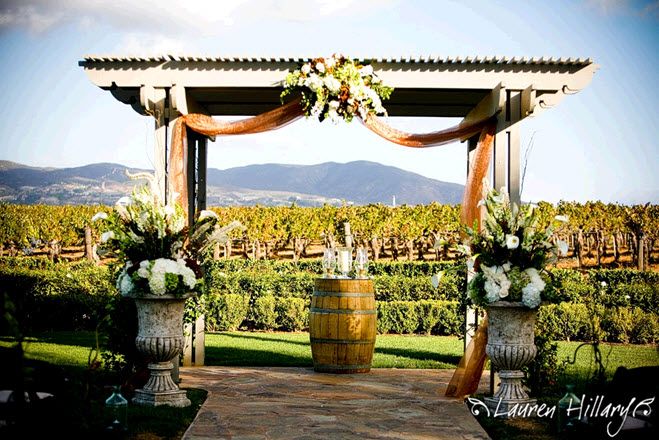 Gorgeous wedding arbor with picturesque Temecula, CA rolling hills in the background