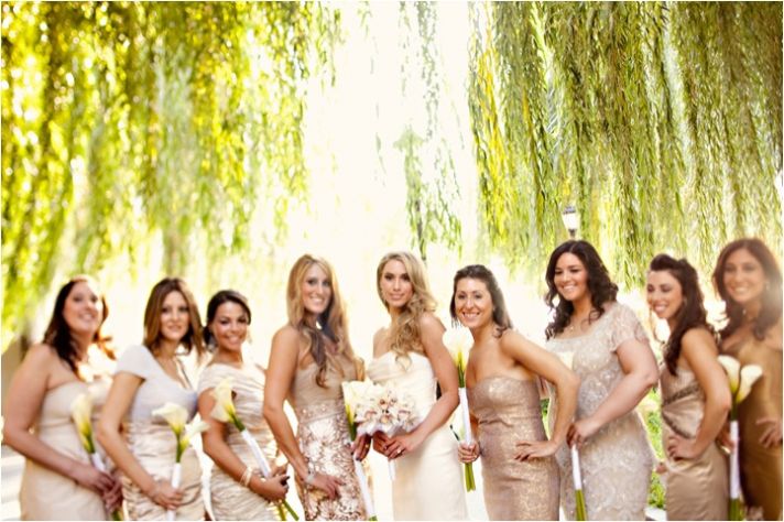 Bridal party wears mix and match gold, champagne and taupe bridesmaids’ dresses