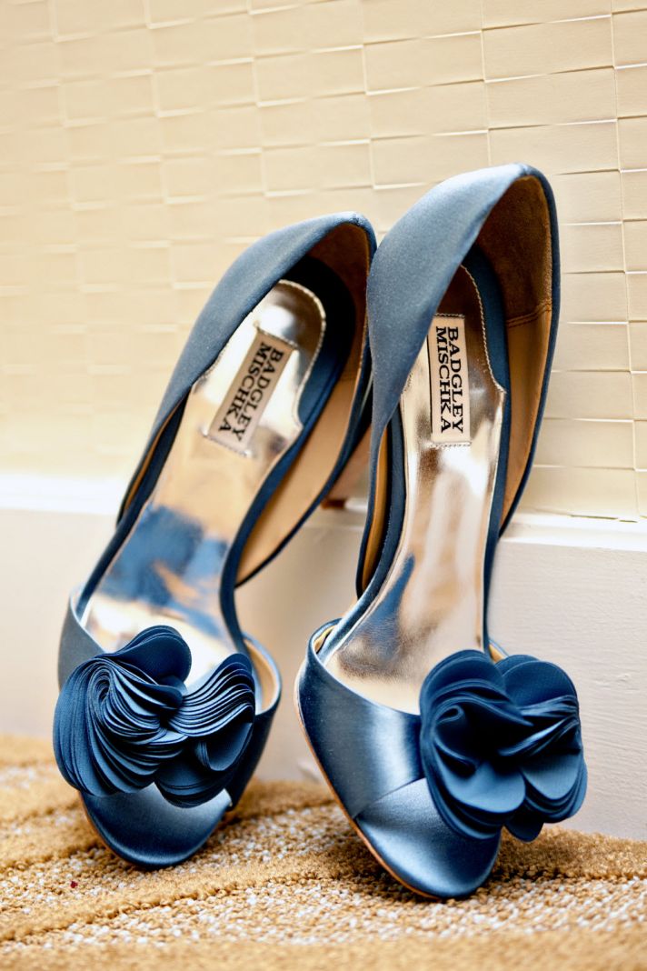 Blue peep-toe Badgely Mischka bridal heels with floral rosette detail