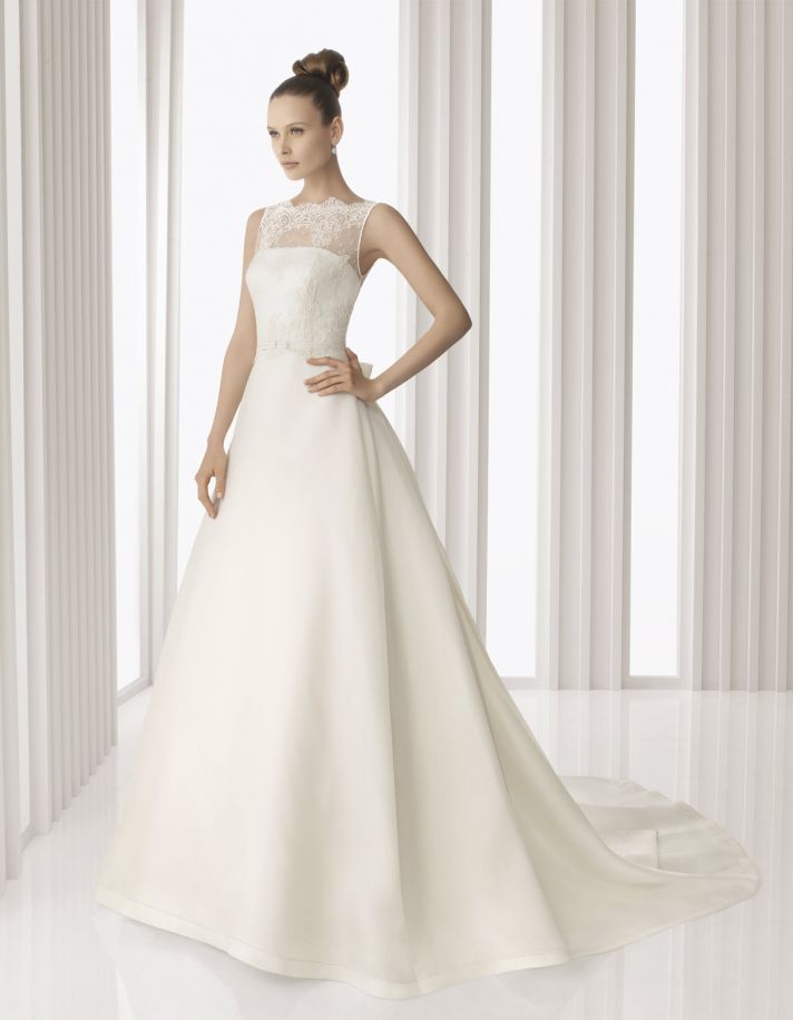 Classic ivory a-line Rosa Clara wedding dress with sheer lace overshirt with 3/4 length sleeves