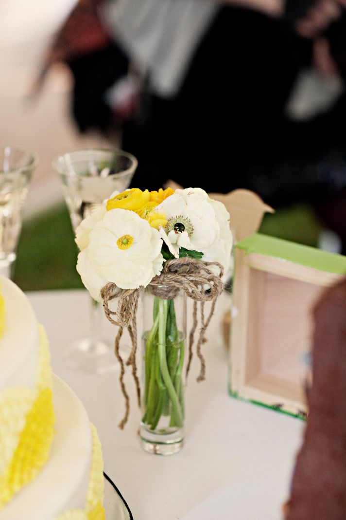 Gorgeous white and yellow Spring bridal bouquet placed in vintage mason jar