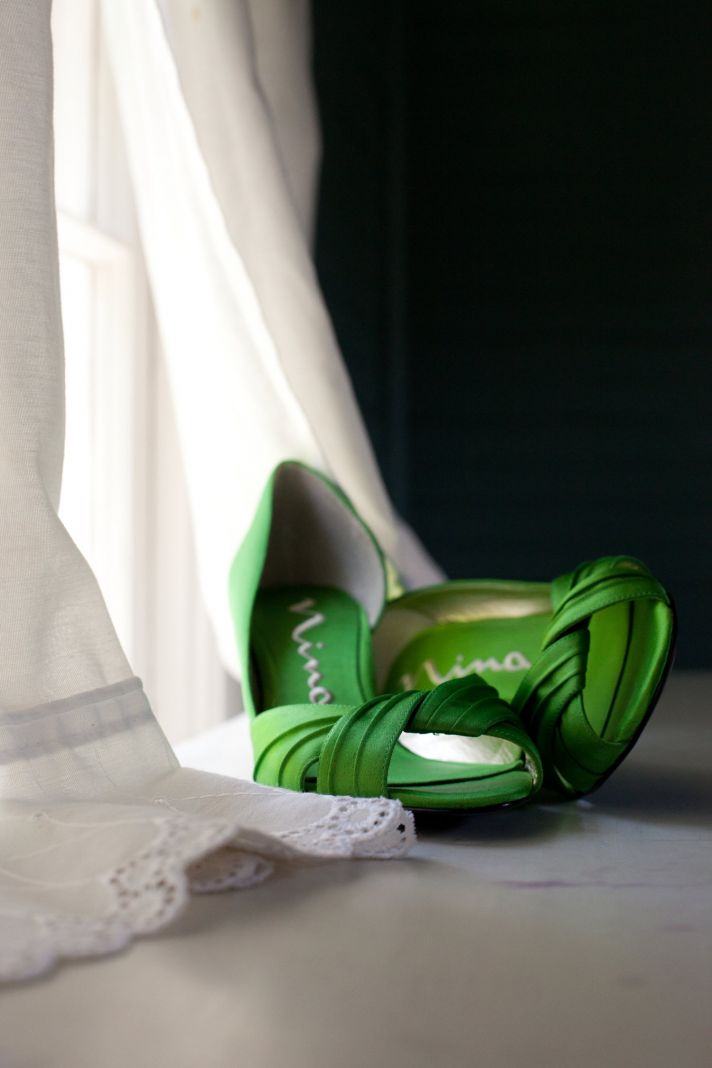 Chic green satin peep-toe bridal heels and ivory lace wedding dress
