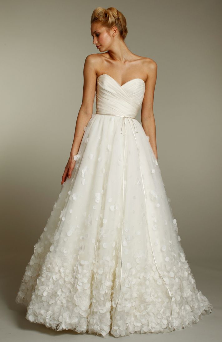 Ivory a-line wedding dress with sweetheart neckline and embellished skirt