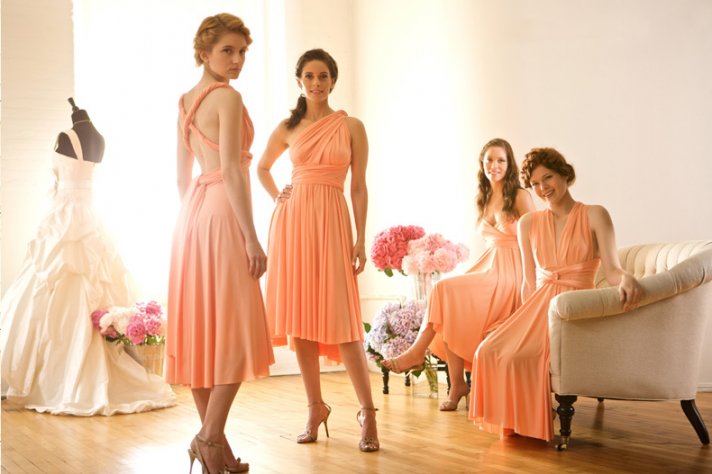 Convertible wrap bridesmaid gowns in soft peach hue