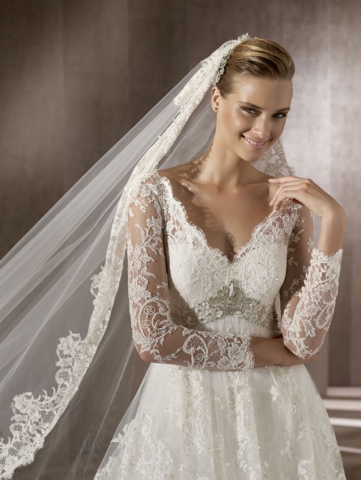 Romantic lace wedding dress with sheer sleeves, traditional bridal veil