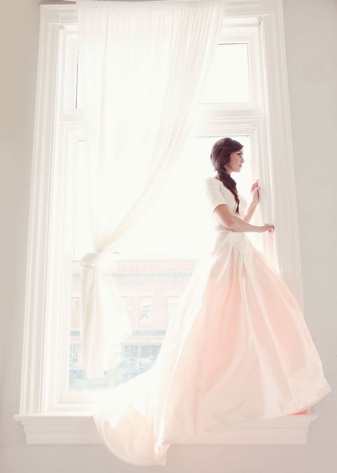 Braided wedding hairstyle, classic wedding dress with sleeves