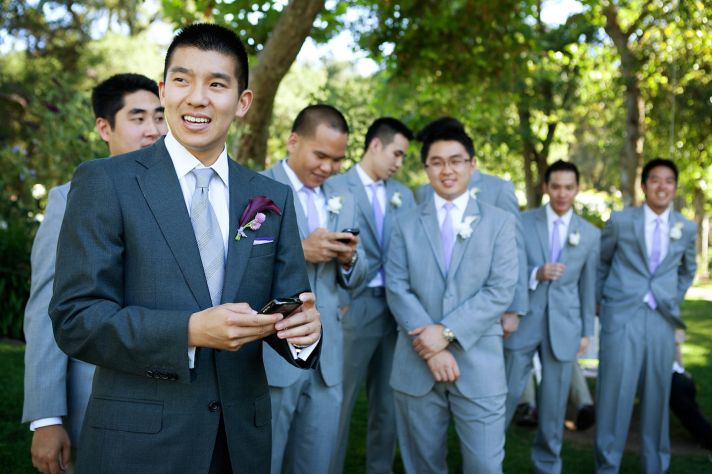 elegant California wedding with bold florals personalized details groom with groomsmen