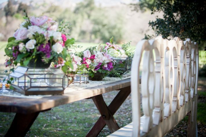 Romantic outdoor wedding reception table vintage chairs