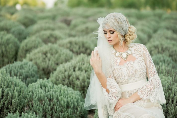 romantic bohemian bride wears sleeved crocheted wedding dress