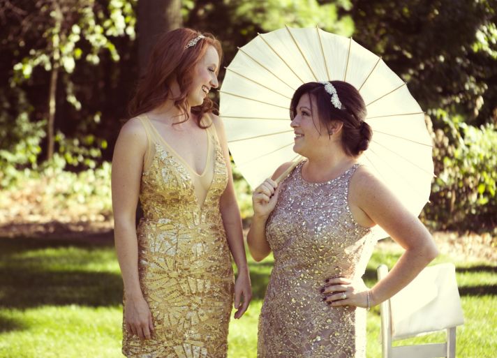 Silver and gold sequined bridesmaids dresses with parasol