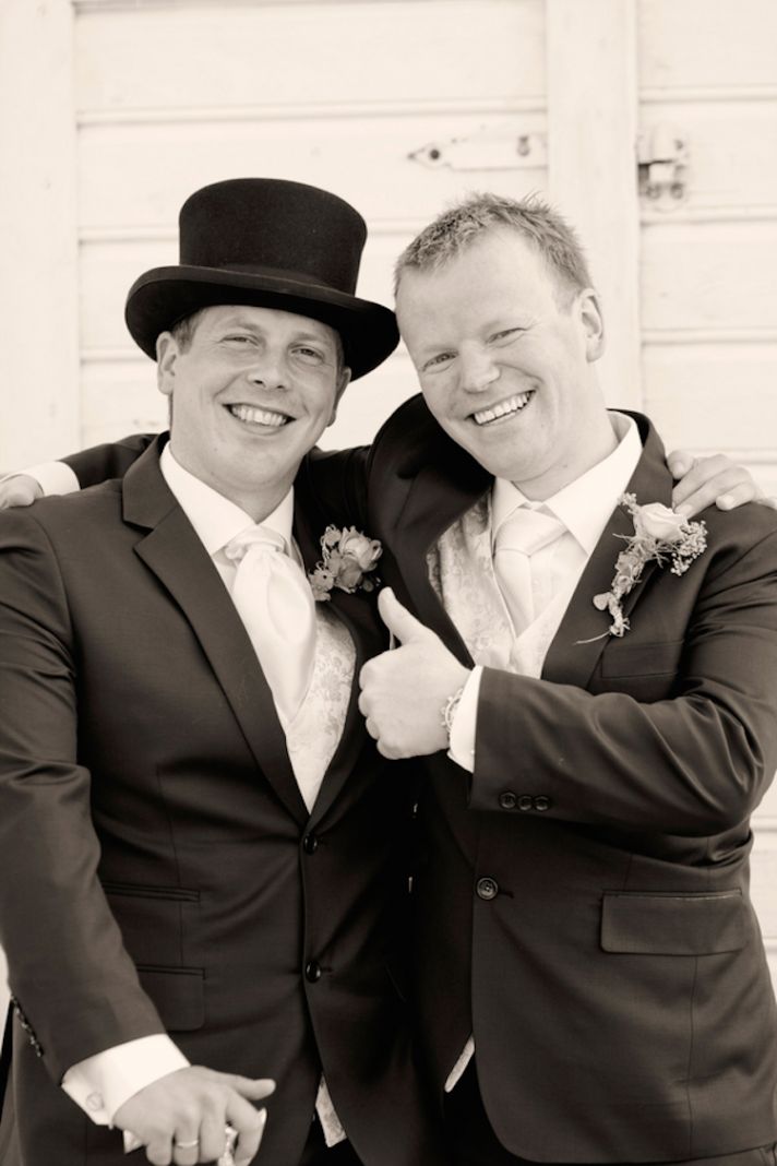 Groom in a top hat with his best man