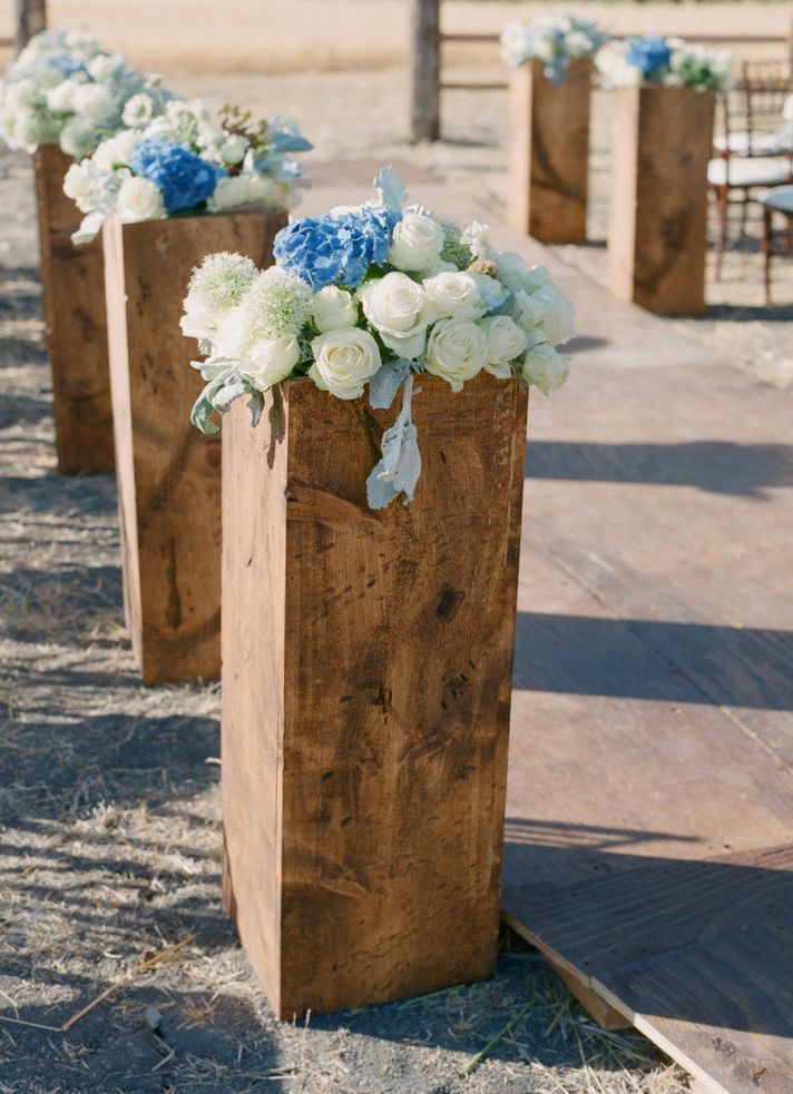Blocks of Wood Topped with Flowers for Aisle Decor