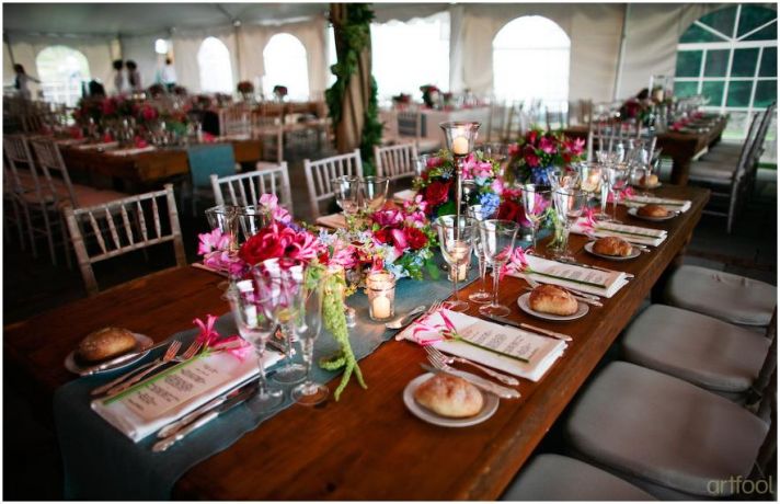 Stunning tablescape (long picnic style) for outdoor wedding reception in white tent