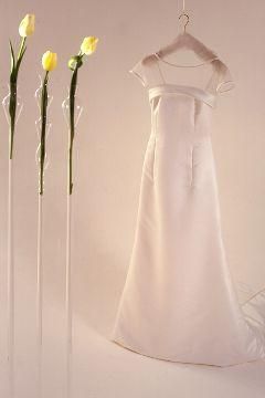 Classic look- simple white modified A-line dress with sheer shoulders; yellow tulips