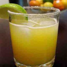A refreshing lime margarita on the rocks.