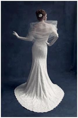 Traditional white wedding dress, long gloves, tulle wrap on shoulders