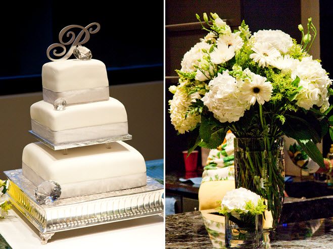 White fondant three tier wedding cake with silver monogram cake topper; high ivory and green floral 