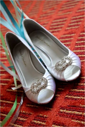 baltimore-outdoor-summer-wedding-red-backdrop-diamond-silver-satin-peep-toe-bridal-heels-rhinestone-brooch-details