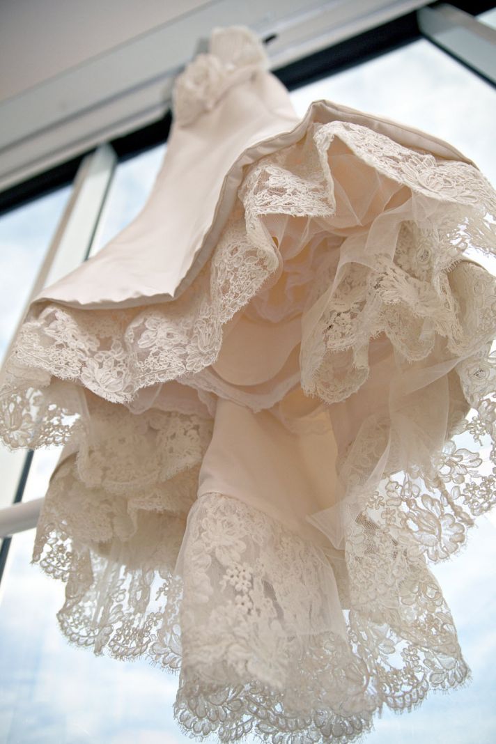 Romantic ivory mermaid wedding dress with lace applique and floral detail