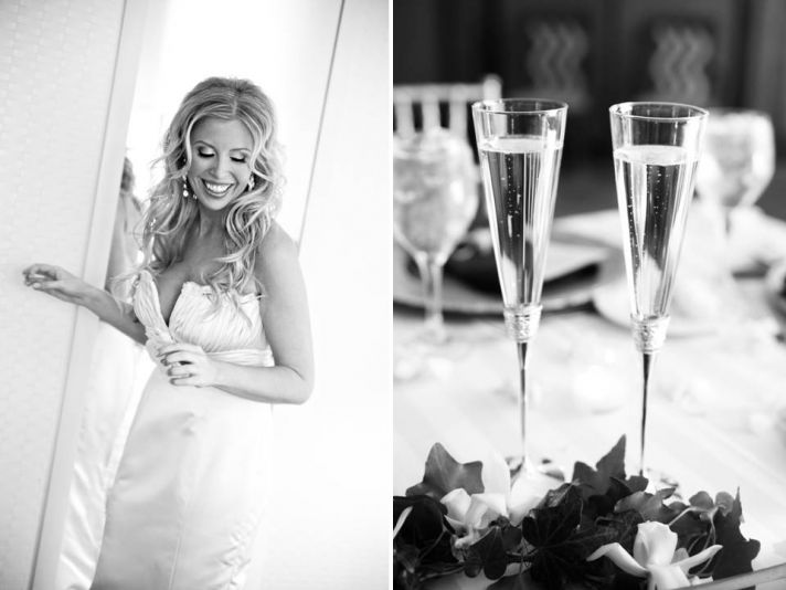 Beautiful bride poses in romantic ivory lace wedding dress; champagne toasting flutes at wedding rec
