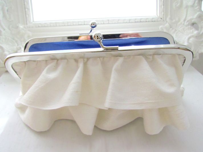 Ivory bridal clutch with elegant ruffles and something blue silk inside