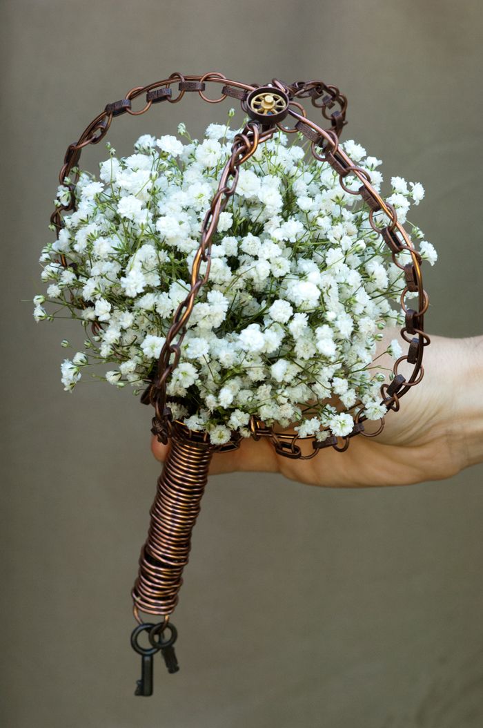 Classic white bridal bouquet with vintage edgy styling