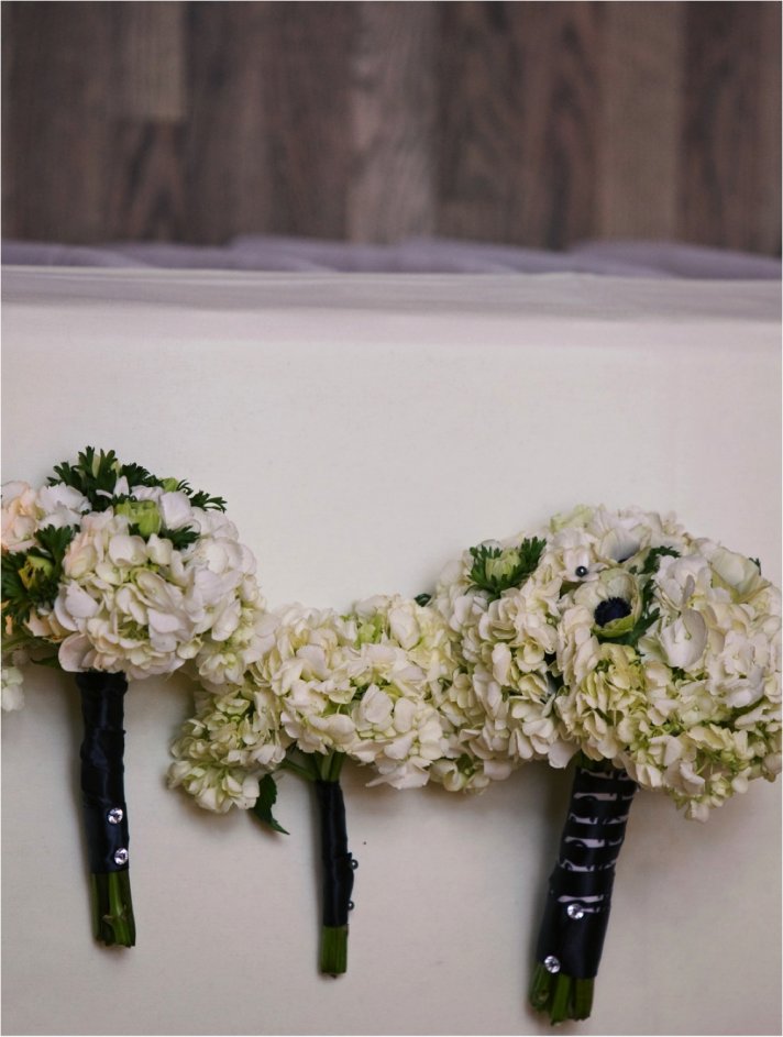 Bridal bouquet of ivory anemones, tied with black satin ribbon