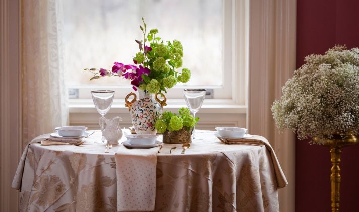 Antique-inspired wedding reception tabletop decor and wedding flower centerpieces
