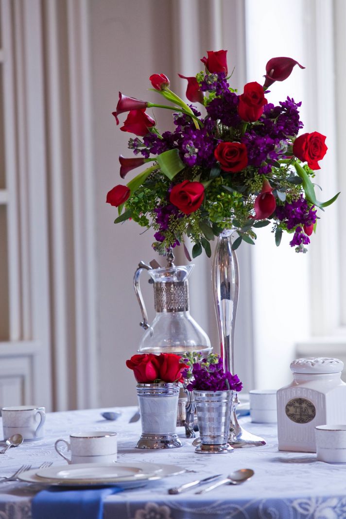 Rich red, purple and green wedding flower centerpiece