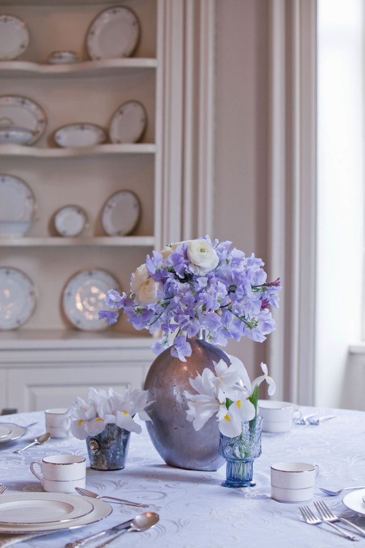 Antique China, lilac and ivory wedding flowers, elegant wedding reception venue