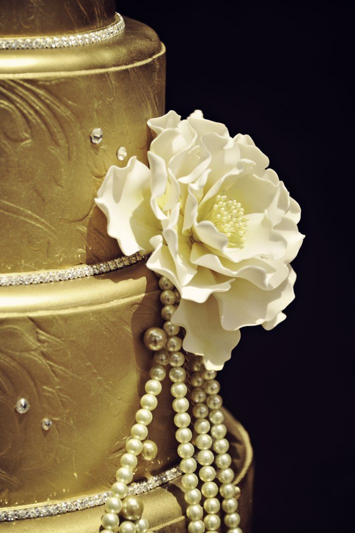 Wedding Cake Detail Shot Gold Pearls and Crystals