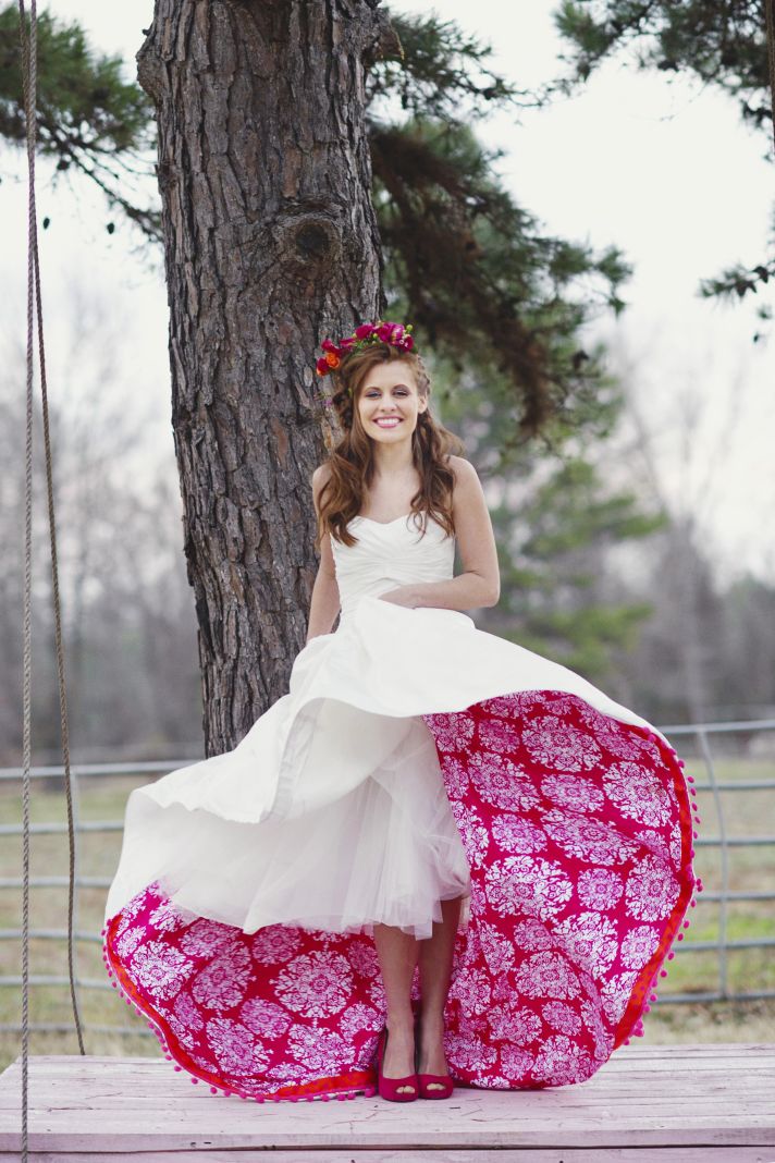 Romantic Bride Poses on Swing Shows Off Pink Petticoat