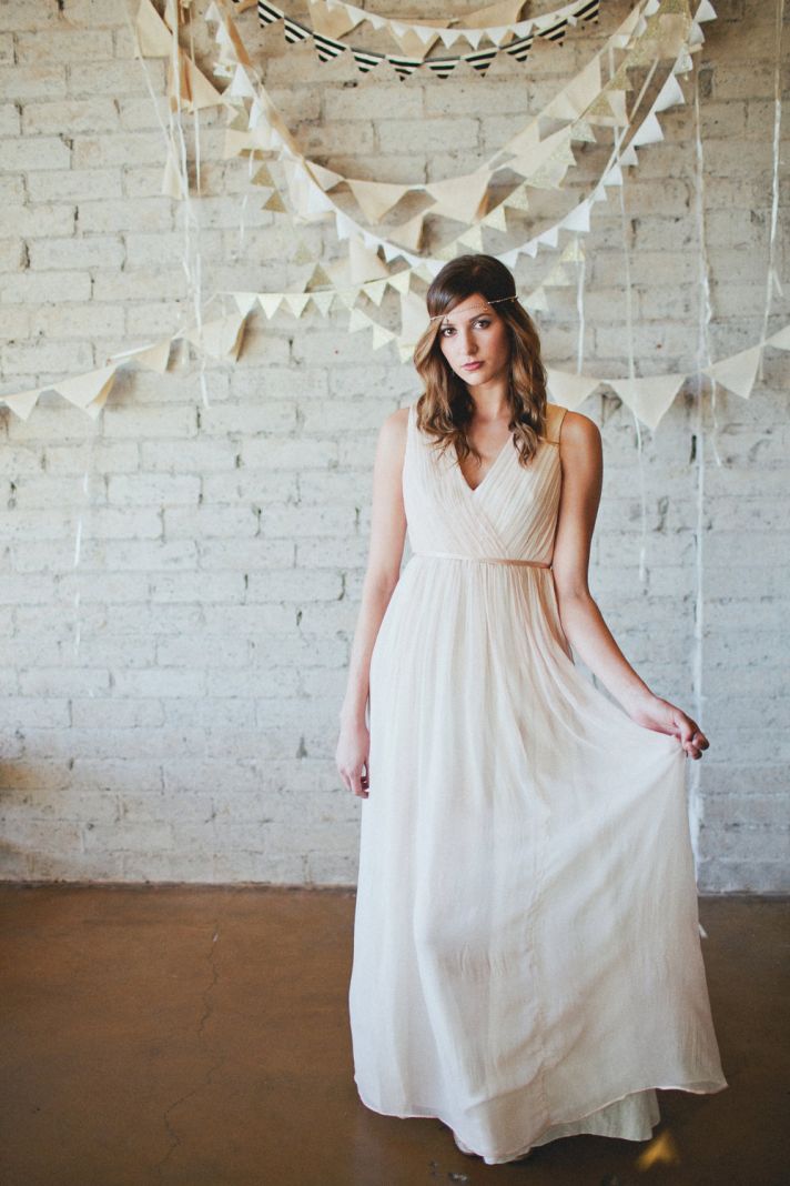 Simple draped wedding dress with open back